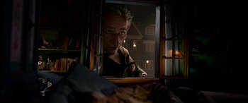 Movie still from “The BFG” (2016), directed by Steven Spielberg – A man looking at himself in a mirror; Medium shot, Over the shoulder angle