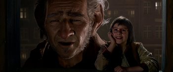 Movie still from “The BFG” (2016), directed by Steven Spielberg – An old man and a little girl are smiling; Close Up shot, Low angle