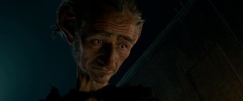 Movie still from “The BFG” (2016), directed by Steven Spielberg – An old man with a pointy nose is looking at the camera; Close Up shot, Low angle