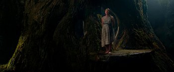 Movie still from “The BFG” (2016), directed by Steven Spielberg – A woman standing in front of a tree in the dark; Wide shot, Low angle