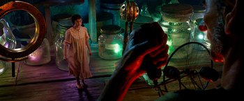 Movie still from “The BFG” (2016), directed by Steven Spielberg – A woman standing in front of a giant hand; Medium shot, High angle