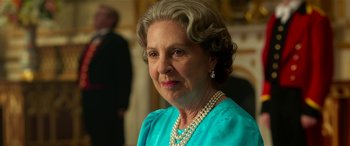 Movie still from “The BFG” (2016), directed by Steven Spielberg – An older woman wearing a blue dress and pearls; Close Up shot, Over the shoulder angle