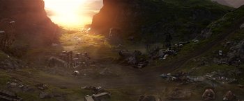 Movie still from “The BFG” (2016), directed by Steven Spielberg – An image of an outdoor scene with the sun setting in the background; Extreme Wide shot, High angle