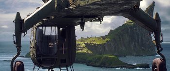 Movie still from “The BFG” (2016), directed by Steven Spielberg – A view from underneath an airplane of a mountain and a lake; Extreme Wide shot, Low angle
