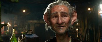 Movie still from “The BFG” (2016), directed by Steven Spielberg – An old man with a gray hair and a strange look on his face; Close Up shot, Low angle