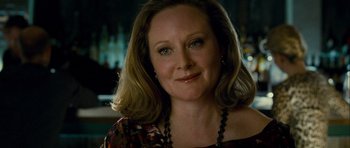 Movie still from “The Best Exotic Marigold Hotel” (2011), directed by John Madden – A person wearing a necklace; Close Up shot, Over the shoulder angle