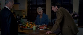 Movie still from “The Best Exotic Marigold Hotel” (2011), directed by John Madden – A man and a woman sitting at a table with a bowl of fruit; Medium shot, High angle
