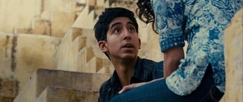 Movie still from “The Best Exotic Marigold Hotel” (2011), directed by John Madden – A man and a woman looking up at one another; Close Up shot, Over the shoulder angle