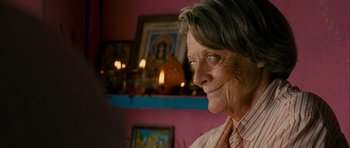 Movie still from “The Best Exotic Marigold Hotel” (2011), directed by John Madden – An older woman is looking into the distance; Close Up shot, Over the shoulder angle