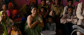 Movie still from “The Best Exotic Marigold Hotel” (2011), directed by John Madden – A group of people sitting around a table; Medium shot, High angle