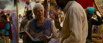 Movie still from “The Best Exotic Marigold Hotel” (2011), directed by John Madden – An older woman sitting in front of a man; Medium shot, Over the shoulder angle