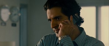 Movie still from “The Best Exotic Marigold Hotel” (2011), directed by John Madden – A person talking on a cell phone; Close Up shot, Low angle