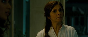 Movie still from “The Best Exotic Marigold Hotel” (2011), directed by John Madden – A person wearing a white shirt; Close Up shot, Over the shoulder angle