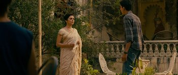 Movie still from “The Best Exotic Marigold Hotel” (2011), directed by John Madden – A woman in a sari talking to a young man; Medium shot, Over the shoulder angle