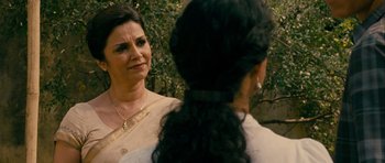 Movie still from “The Best Exotic Marigold Hotel” (2011), directed by John Madden – A woman in a white shirt and a man in a white shirt; Close Up shot, Over the shoulder angle