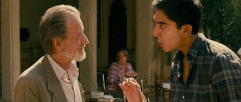 Movie still from “The Best Exotic Marigold Hotel” (2011), directed by John Madden – A man and a woman talking to each other outside; Medium shot, Over the shoulder angle