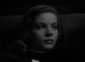 Movie still from “The Big Sleep” (1946), directed by Howard Hawks – A black - and - white photo of a woman in a car seat; Close Up shot, Low angle