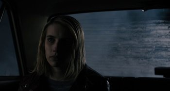 Movie still from “The Blackcoat's Daughter” (2015), directed by Oz Perkins – A woman with long blonde hair sitting in a car; Close Up shot, Over the shoulder angle