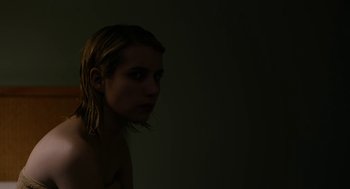 Movie still from “The Blackcoat's Daughter” (2015), directed by Oz Perkins – A young woman with blonde hair is standing in a dark room; Close Up shot, High angle