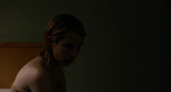 Movie still from “The Blackcoat's Daughter” (2015), directed by Oz Perkins – A woman with wet blonde hair standing in a dark room; Close Up shot, High angle