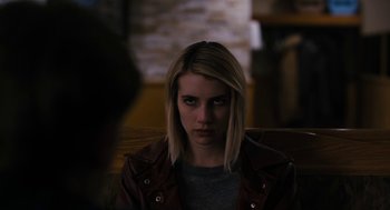 Movie still from “The Blackcoat's Daughter” (2015), directed by Oz Perkins – A woman with blonde hair sitting in a chair; Close Up shot, Over the shoulder angle