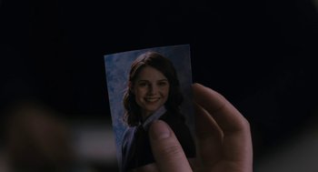 Movie still from “The Blackcoat's Daughter” (2015), directed by Oz Perkins – A hand holding a picture of a woman; Extreme Close Up shot, Overhead angle