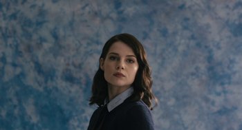 Movie still from “The Blackcoat's Daughter” (2015), directed by Oz Perkins – A woman in a dress shirt and tie; Close Up shot, Low angle
