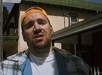 Movie still from “The Blair Witch Project” (1999), directed by Eduardo Sánchez – A person wearing a hat; Close Up shot, Low angle