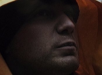 Movie still from “The Blair Witch Project” (1999), directed by Eduardo Sánchez – A man's face in the dark; Extreme Close Up shot, Low angle
