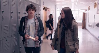 Movie still from “The Bling Ring” (2013), directed by Sofia Coppola – Two people walking in a hallway near each other; Medium shot, Over the shoulder angle