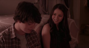 Movie still from “The Bling Ring” (2013), directed by Sofia Coppola – A man and a woman sitting next to each other on a couch; Close Up shot, Over the shoulder angle