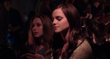 Movie still from “The Bling Ring” (2013), directed by Sofia Coppola – Two young women are looking at a cell phone; Close Up shot, Low angle
