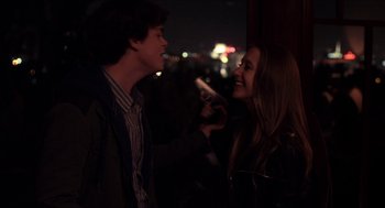 Movie still from “The Bling Ring” (2013), directed by Sofia Coppola – A man and a woman are smiling at each other; Close Up shot, Over the shoulder angle