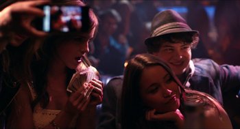 Movie still from “The Bling Ring” (2013), directed by Sofia Coppola – A group of young people sitting in a room together; Medium shot, Over the shoulder angle