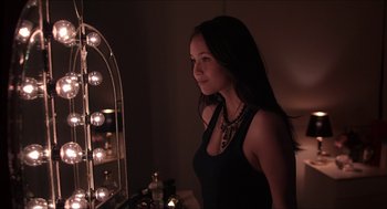 Movie still from “The Bling Ring” (2013), directed by Sofia Coppola – A beautiful young lady standing in front of a vanity mirror; Close Up shot, Over the shoulder angle