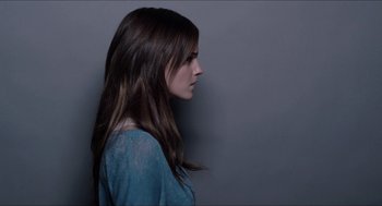 Movie still from “The Bling Ring” (2013), directed by Sofia Coppola – A woman with long brown hair wearing a blue shirt; Close Up shot, Over the shoulder angle
