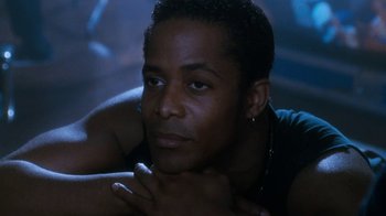 Movie still from “The Bodyguard” (1992), directed by Mick Jackson – A person laying on the ground; Close Up shot, Low angle