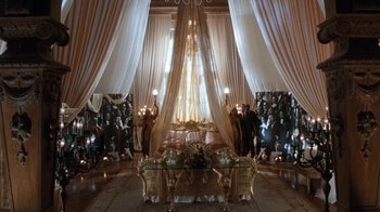 Movie still from “The Bodyguard” (1992), directed by Mick Jackson – A room filled with furniture and a large window; Extreme Wide shot, High angle