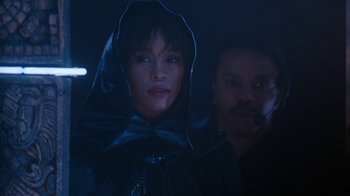 Movie still from “The Bodyguard” (1992), directed by Mick Jackson – A man and a woman standing next to each other in the dark; Close Up shot, Low angle