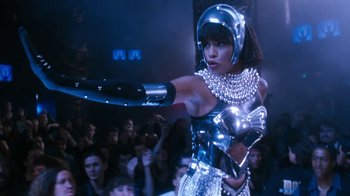 Movie still from “The Bodyguard” (1992), directed by Mick Jackson – A woman dressed as a futuristic robot in front of an audience; Medium shot, Low angle
