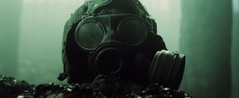 Movie still from “The Book of Eli” (2010), directed by Allen Hughes – A person wearing a gas mask; Close Up shot, Low angle