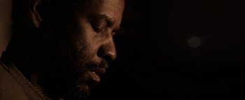 Movie still from “The Book of Eli” (2010), directed by Allen Hughes – A man's face in the dark; Close Up shot, Low angle