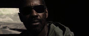 Movie still from “The Book of Eli” (2010), directed by Allen Hughes – A person wearing sunglasses; Close Up shot, Low angle
