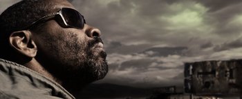 Movie still from “The Book of Eli” (2010), directed by Allen Hughes – A person wearing sunglasses; Extreme Close Up shot, Low angle