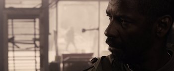 Movie still from “The Book of Eli” (2010), directed by Allen Hughes – A person with a beard; Close Up shot, Over the shoulder angle