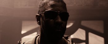 Movie still from “The Book of Eli” (2010), directed by Allen Hughes – A person wearing sunglasses; Close Up shot, Low angle