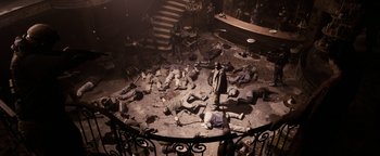 Movie still from “The Book of Eli” (2010), directed by Allen Hughes – A group of dead bodies laying on top of a floor; Wide shot, High angle