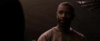 Movie still from “The Book of Eli” (2010), directed by Allen Hughes – A man with a beard is looking at the camera; Close Up shot, Over the shoulder angle