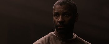 Movie still from “The Book of Eli” (2010), directed by Allen Hughes – A man with a beard is looking into the distance; Close Up shot, Low angle