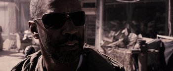 Movie still from “The Book of Eli” (2010), directed by Allen Hughes – A person wearing sunglasses; Close Up shot, Low angle